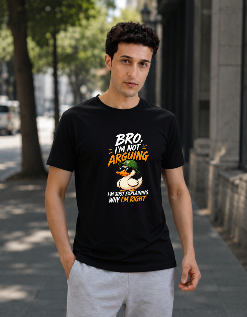 A man wearing a black graphic t-shirt with a duck illustration and the text 'Bro I'm Not Arguing I'm Just Explaining Why I'm Right' stands on a city sidewalk.