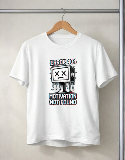 A white short-sleeve crewneck t-shirt hanging on a wooden hanger against a light beige wall. The shirt features a 'ERROR 404 MOTION NOT FOUND' cartoon graphic of a sad TV character with dripping paint.