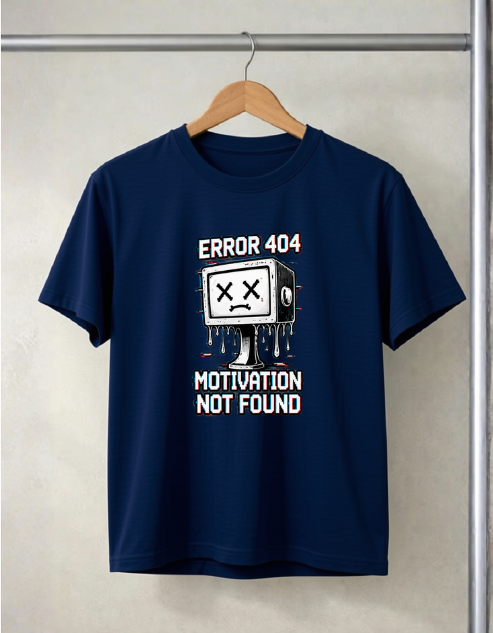 A navy blue short-sleeve t-shirt hanging on a wooden hanger against a textured light gray wall. The shirt features a white graphic of a melting computer monitor with 'ERROR 404' above it and 'MOTIVATION NOT FOUND' below.