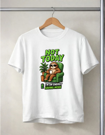 A white short-sleeve t-shirt hanging on a wooden hanger against a light beige wall. The shirt features a cartoon sloth sitting in a green armchair with the text 'NOT TODAY' above and 'I'M ON ENERGY SAVING MODE' below.