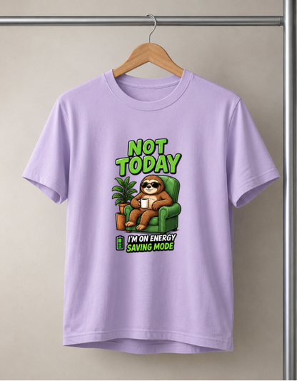A Lavender color short-sleeve t-shirt hanging on a wooden hanger against a beige wall. The shirt features a cartoon graphic of a sloth wearing sunglasses and relaxing in a green armchair, with the text 'NOT TODAY' above and 'I'M ON ENERGY SAVING MODE' below.