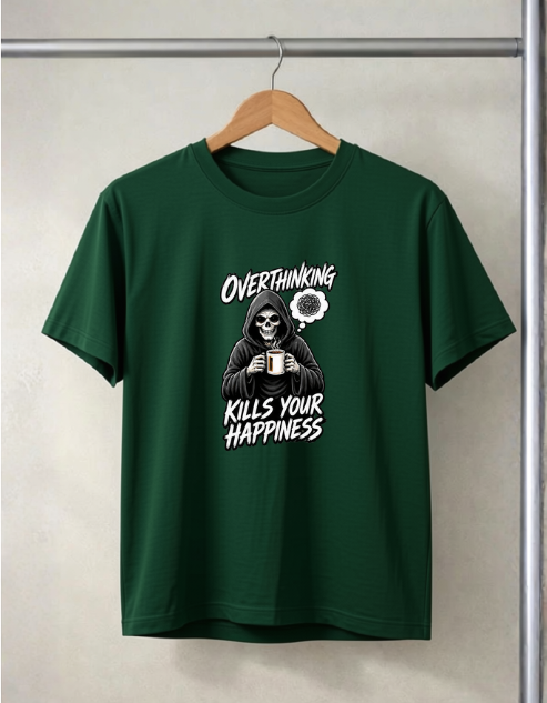 A Bottle Green short-sleeve t-shirt hanging on a wooden hanger against a light gray textured wall. The shirt features a white graphic print of a skeleton in a hoodie holding a mug, with the text 'OVERTHINKING KILLS YOUR HAPPINESS' and a small flower illustration.