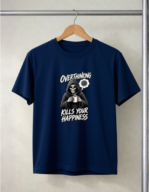 A navy blue short-sleeve t-shirt hanging on a wooden hanger against a light gray textured wall. The shirt features a white graphic print of a skeleton in a hoodie holding a mug, with the text 'OVERTHINKING KILLS YOUR HAPPINESS' and a small flower illustration.